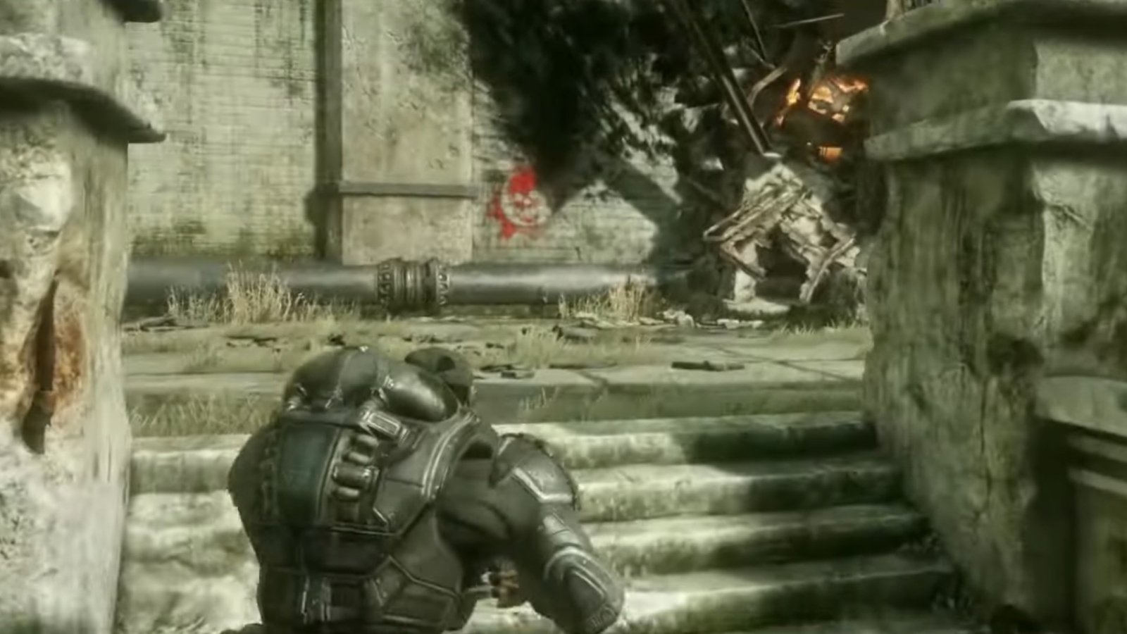 Gears of War: Reloaded screenshot featuring a red Gears of War icon up a flight of stairs.
