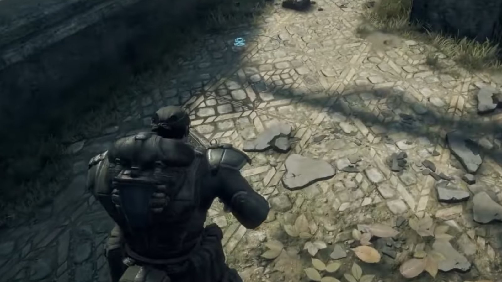 Gears of War: Reloaded screenshot featuring a COG Tag laying on the ground beside a cover.