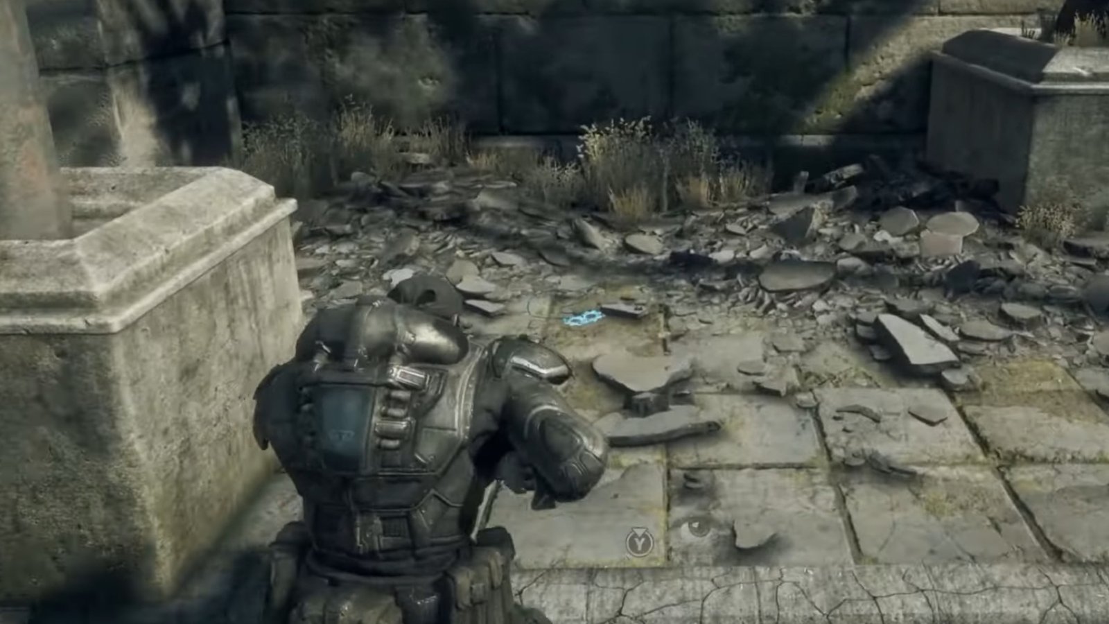 Gears of War: Reloaded screenshot featuring a COG Tag on the ground by a rubble and some supplies.
