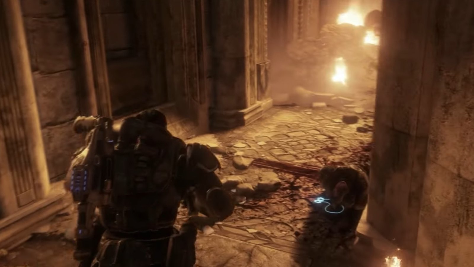 Gears of War: Reloaded screenshot featuring a COG Tag lying around the corner of a fiery hallway.