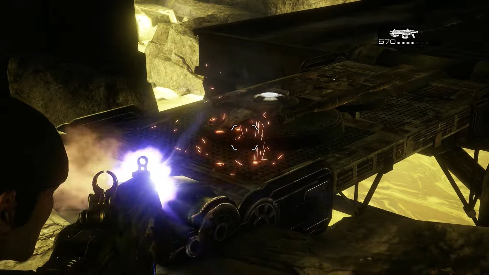 Gears of War: Reloaded screenshot featuring Marcus shooting at the clamps on the ground that's holding up a platform.