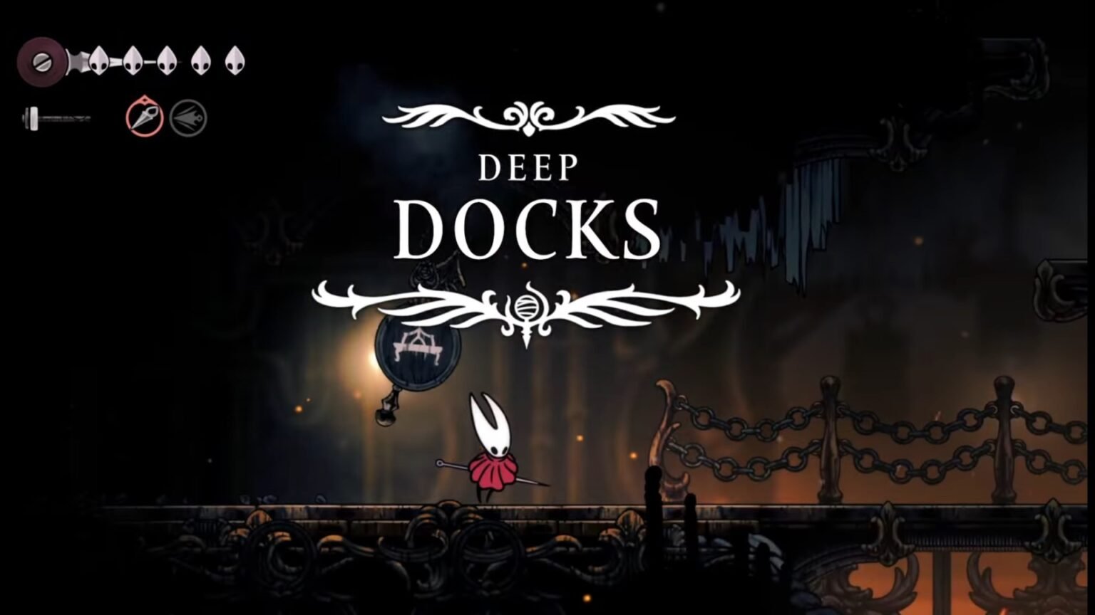 Hollow Knight: Silksong screenshot featuring Hornet at the Deep Docks area.