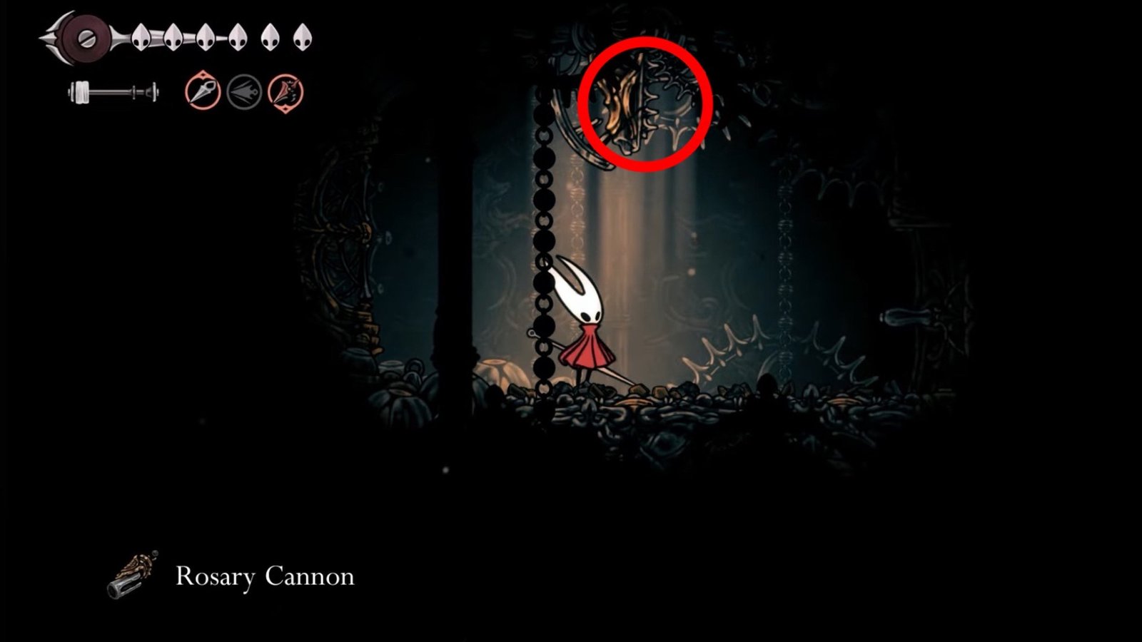 Silksong featuring the Hornet picking up the Rosary Cannon.