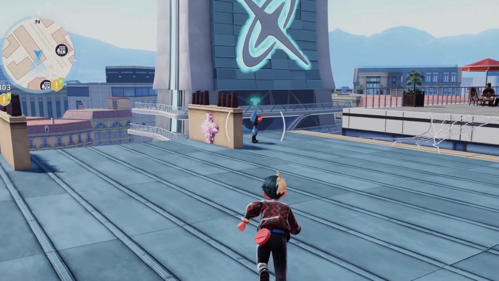 Pokémon Legends: Z-A screenshot featuring the player catching Riolu on the rooftop.