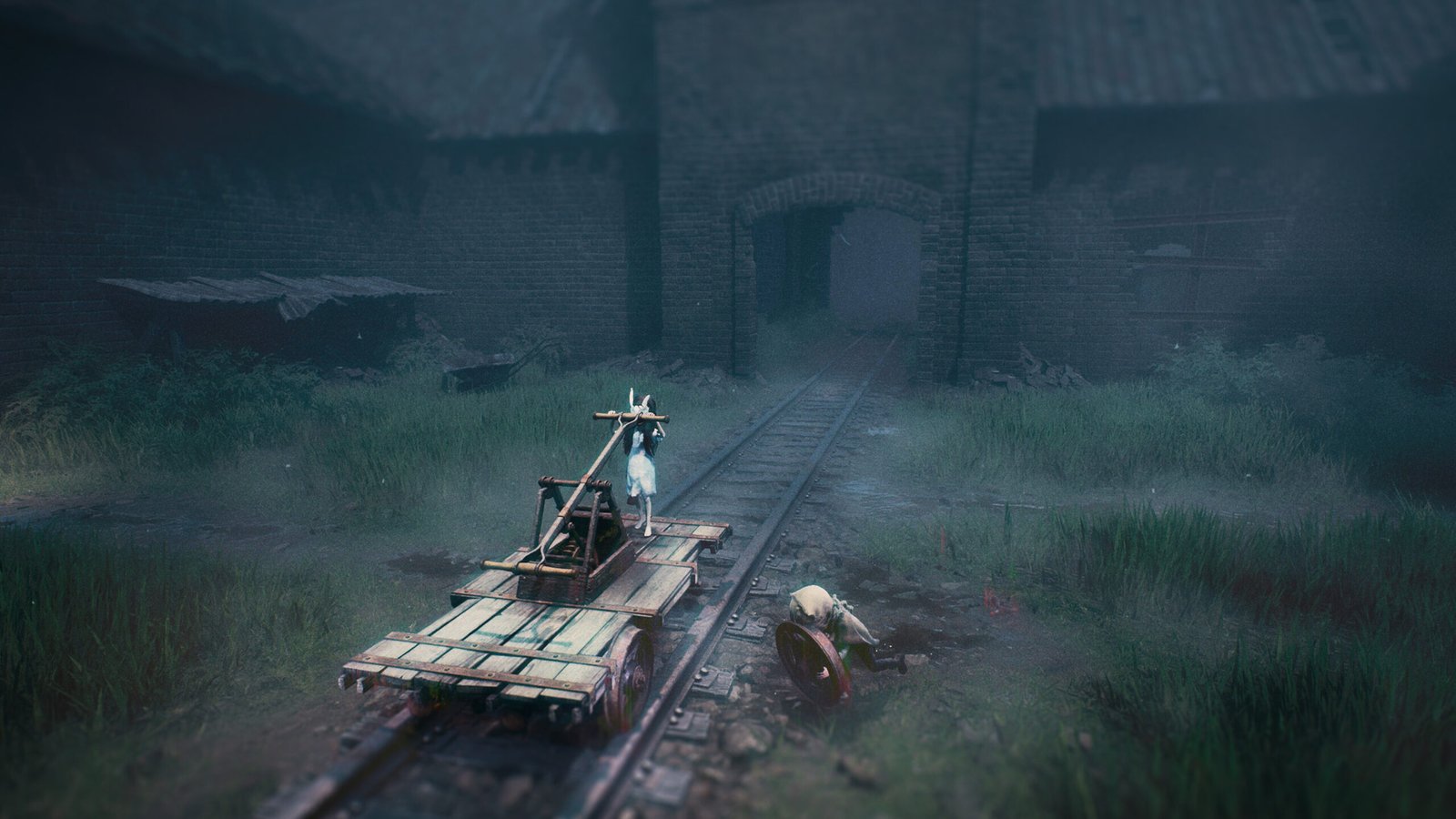 Reanimal screenshot featuring The Boy and The Girl fixing the broken cart at the Trainyard.