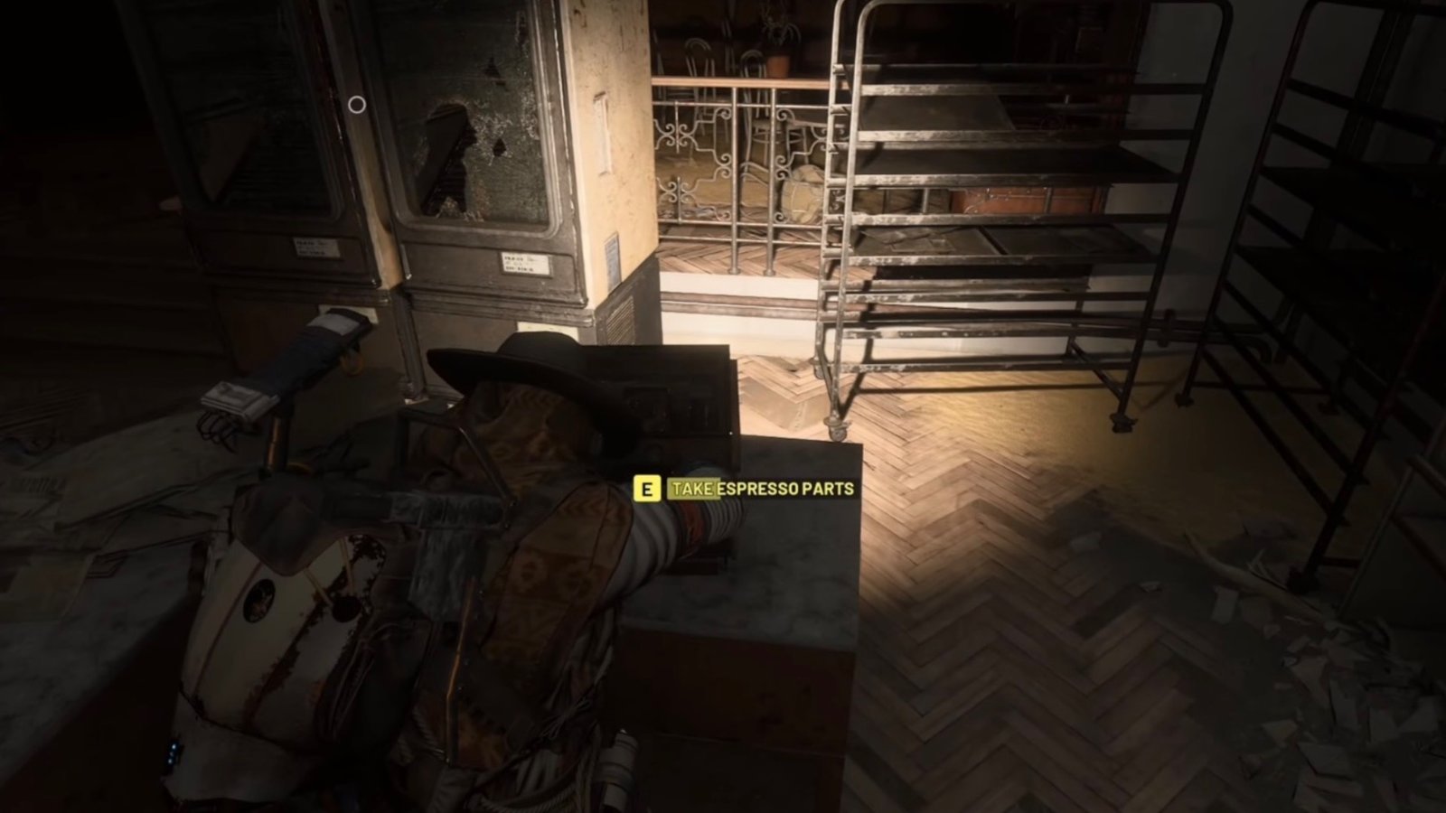 ARC Raiders salvaging parts from the espresso machine.