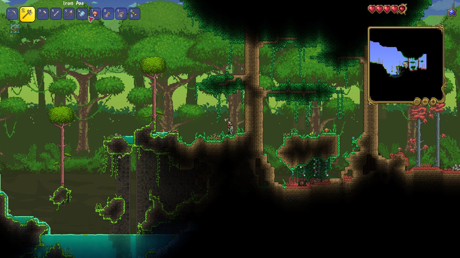 Image of a player chopping a tree next to a set of Living Trees and a Crimson Biome in the Drunk Seed in Terraria.
