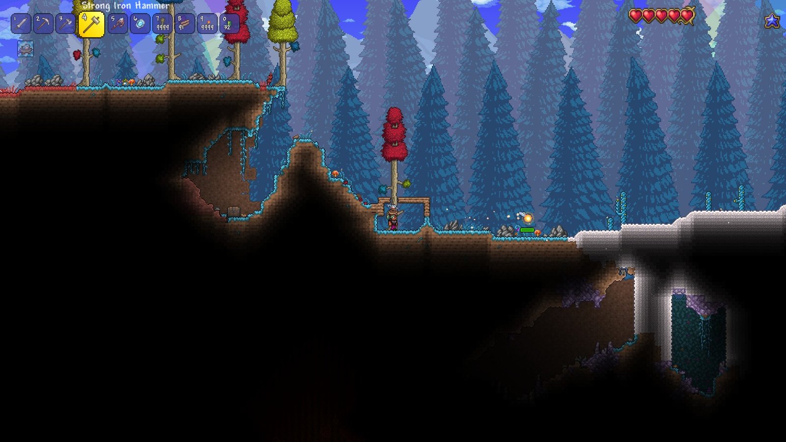Screenshot of a player starting in Hardmode in Terraria, mining a Pearlwood Tree.