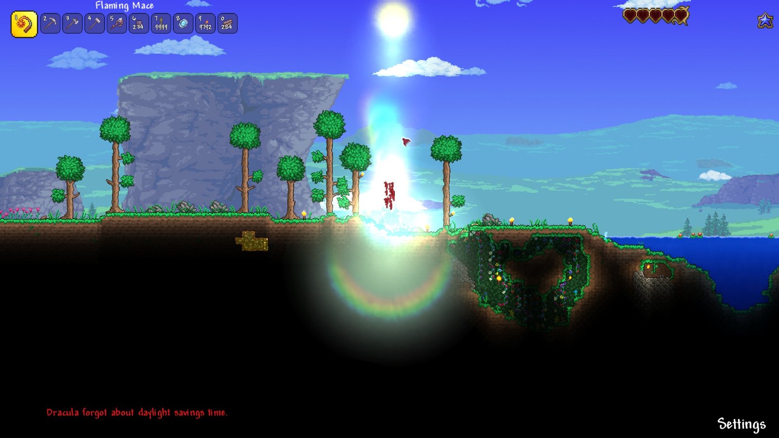 Screenshot of the player burning up on the surface of Terraria's vampirism seed.