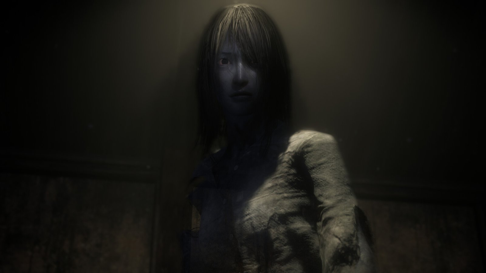 A ghostly apparition showing dark hair and a pale face in Fatal Frame II: Crimson Butterfly Remake.