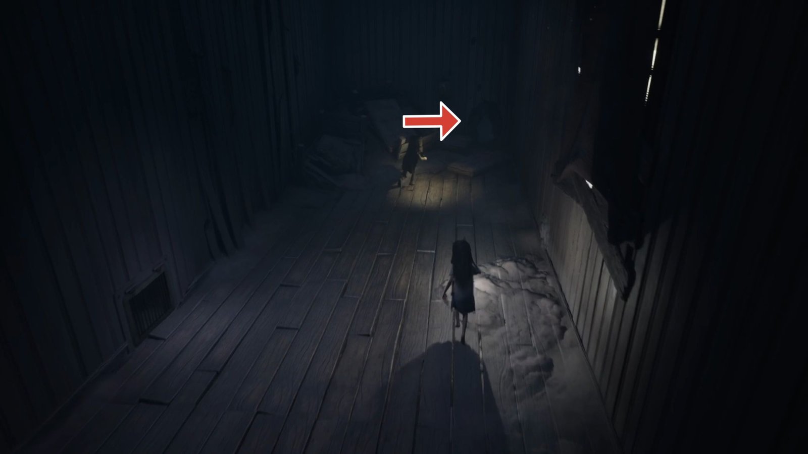 Arrow pointing to the hole that leads to a hidden statue in Reanimal