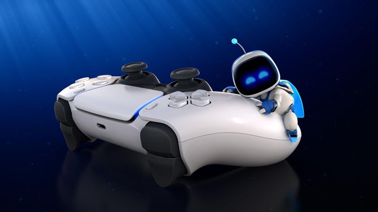 Astro Bot hugging a PlayStation 5 controller