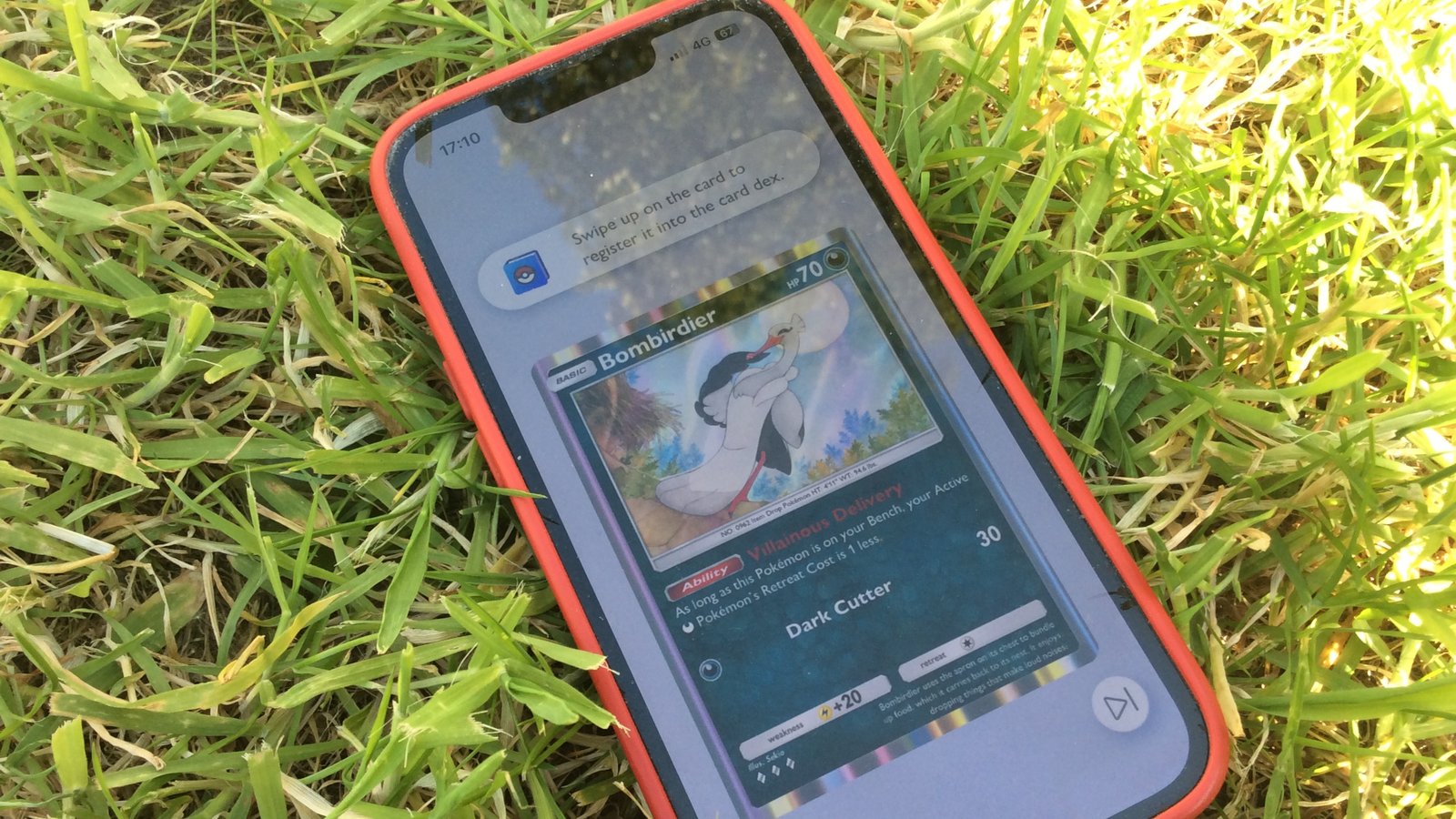 Pokemon TCG Pocket Pulsing Aura Bombirdier card on iPhone outdoors